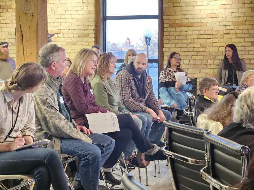 Community members gather in Bemidji's Mayflower Building on Tuesday, Dec. 5, 2023, in support of postal workers who say working conditions have deteriorated since a shift to Amazon package delivery.