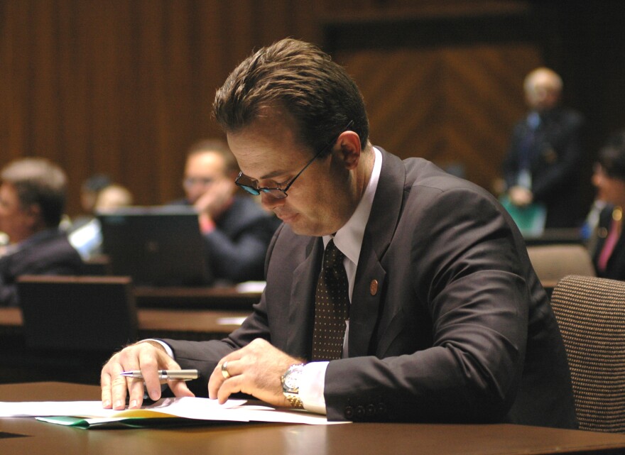 House Speaker Kirk Adams reviews his notes as lawmakers debate a package of spending cuts and fund transfers. Adams got sujfficient votes from Republican colleagues for the plan despite the concerns that a few expressed over some provisions.