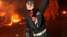 Occupy Oakland protester Mike Clift ran from teargas early today (Nov. 3, 2011).