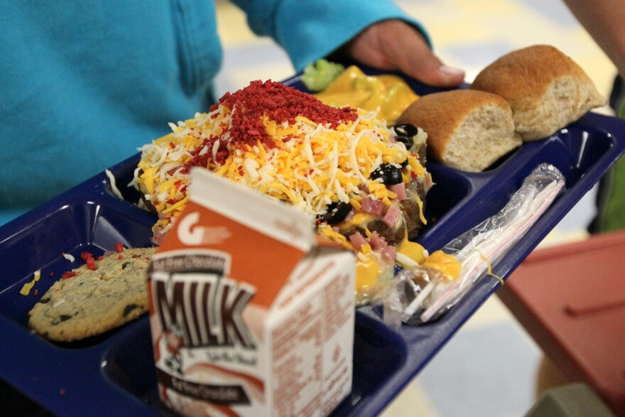 A baked potato with toppings on a lunch tray at a school in Wisconsin. Students are less likely to eat fruits and vegetables if they're rushing to get to recess, researchers say.