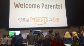 Amazon employees and their parents explore a "science fair" at the company's first ever "Bring Your Parents to Work" day.