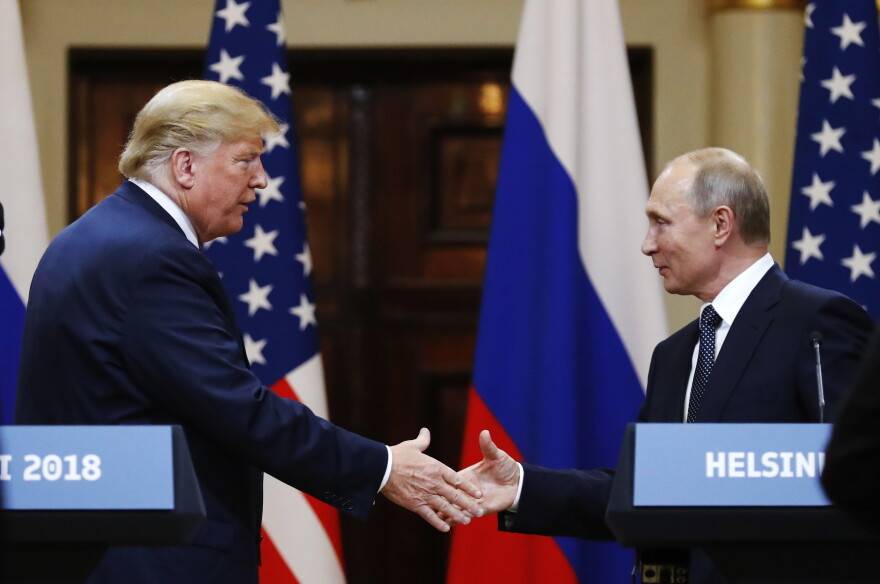 U.S. President Donald Trump shakes hand with Russian President Vladimir Putin at the end of the press conference after their meeting at the Presidential Palace in Helsinki, Finland, Monday, July 16, 2018.