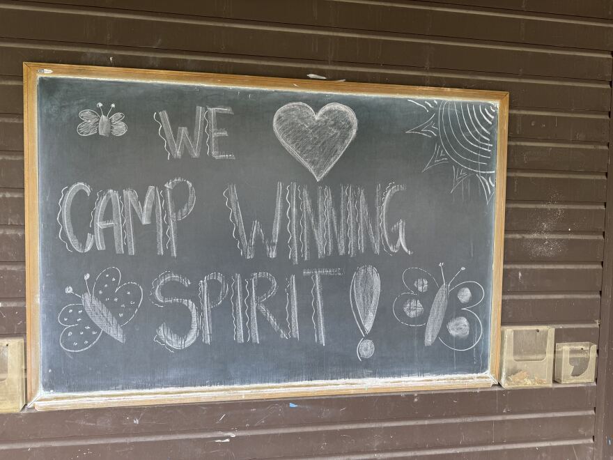 A chalkboard drawing at YMCA Camp Coniston in Grantham with art from the 2025 Camp Winning Spirt.