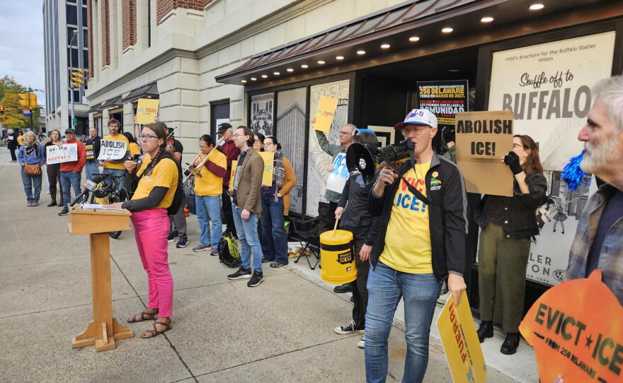 Protesters stand outside the Statler Building, calling for Carl Montante to end rental agreements with ICE