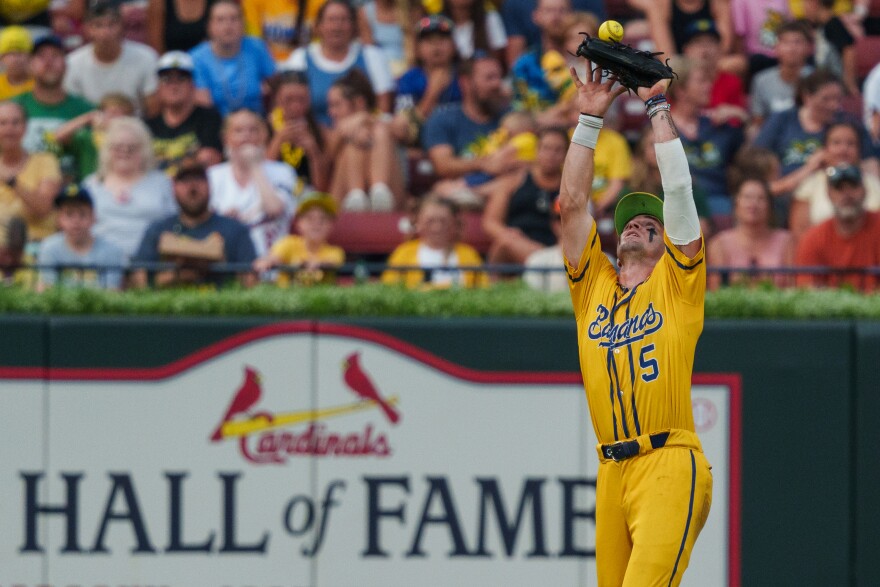 Centerfield David Meadows bounces a fly ball off the top of his glove before catching it during a baseball game between the Savannah Bananas and the Party Animals at Busch Stadium on Friday, July 18, 2025, in downtown St. Louis.