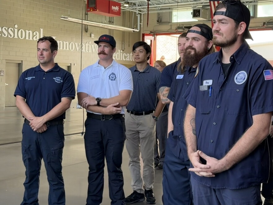 Gainesville Fire Rescue firefighters, EMTs, and paramedics watch as their new engine is shown to the public. (Genesis Trujillo/WUFT News)