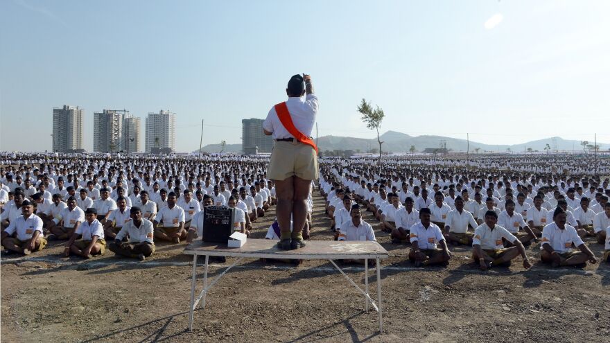 RSS members sit in formation as they listen to instructions at a rally in Pune in 2016.