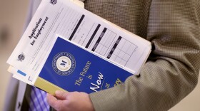 Looking for work in Florida. At a November career fair in West Palm Beach, this man had a job application in hand.