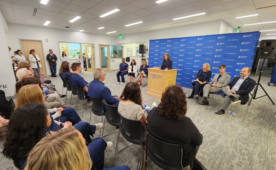 Penn State Regional Chancellor Elizabeth Wright addresses the crowd in the school's library.