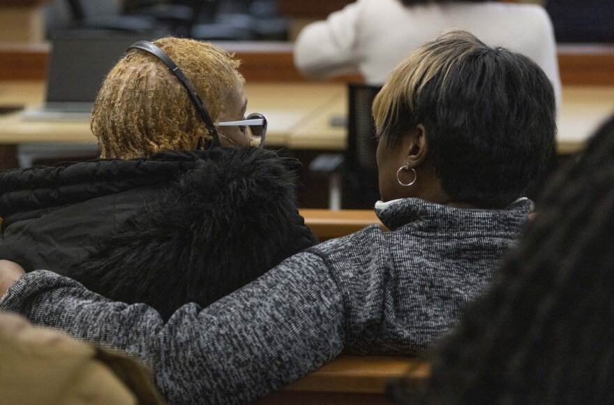 Manny Ellis' mother, Marcia Carter-Patterson, left, gets support from a woman before the verdicts are read by Pierce County Judge Bryan Chushcoff for the killing of Manny Ellis in Pierce County Superior Court Thursday, December 21, 2023. The three officers who were accused, Timothy Rankine, Christopher "Shane" Burbank and Matthew Collins were all found not guilty.