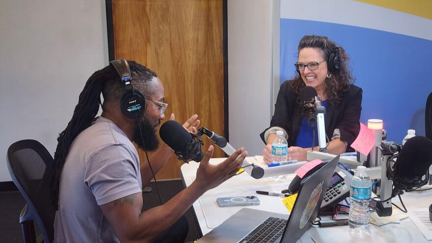 Interim First Coast Connect host Al Letson passes the mic to new host Anne Schindler, who starts in the role on Oct. 30.