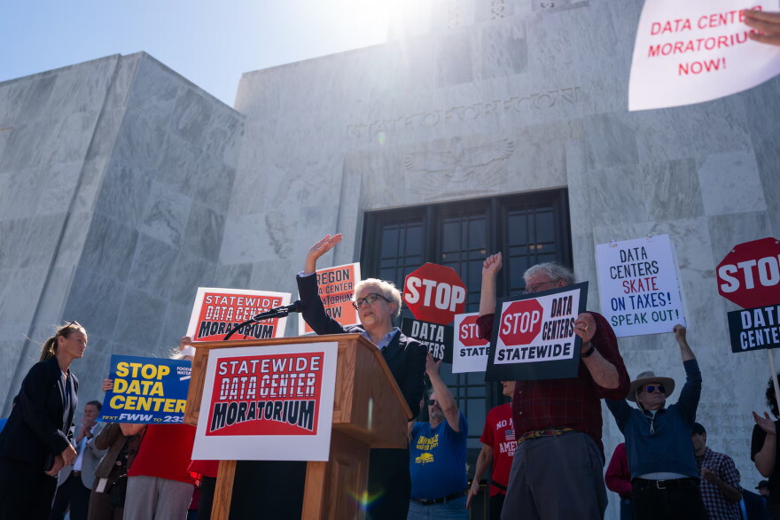 Oregon Gov. Tina Kotek waves goodbye to the crowd after speaking against data centers during a protest advocating for a statewide data center moratorium in front of the Oregon State Capitol in Salem, Ore., on Sept. 8, 2026.