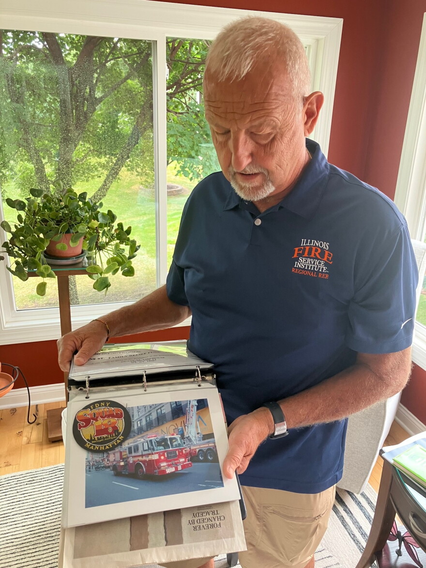 Retired Davenport firefighter Ray Palczynski looks at his 9/11 scrapbook, with a page including a patch from FDNY's Squad 18 (to which his friend Andy Fredericks, a squad member, was killed responding to the Sept. 11 attacks) and a photo of an FDNY fire truck.
