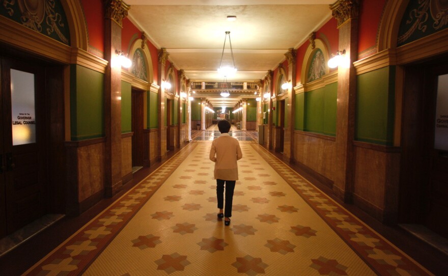 Bartlett walks through the Montana Statehouse. She held off hospital CEO and lobbyists' attempts to make an end run around her push for new pricing.