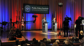 Former and current Jacksonville Mayors Alvin Brown, left, and Lenny Curry talk about gun violence during a debate at Jacksonville University in 2015.