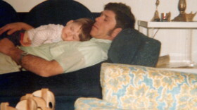 Courtney Farr sleeps on his father's chest when he was a young boy, in 1979.