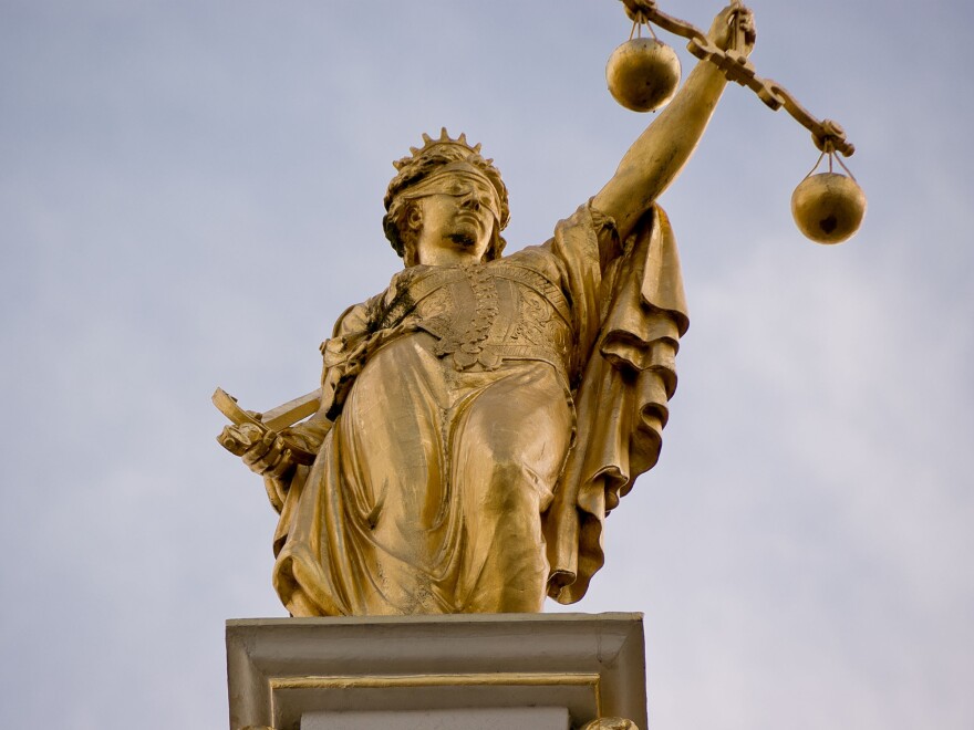 "Golden lady justice" in Bruges, Belgium.