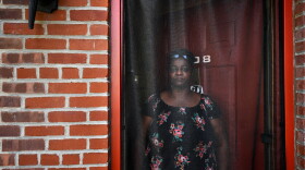 Dione Dwyer in front of her home on August 30, 2021. Dione, a single mother, has lived in affordable housing in Bridgeport for 19 years. She is the system change fellow at PT Barnum complex. Prior to having affordable housing, Dione was jumping between staying with relatives while trying to maintain stability in her children's lives.
