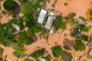 An aerial view of homes surrounded by floodwaters in Waialua, Hawaiʻi, Friday, March 20, 2026.