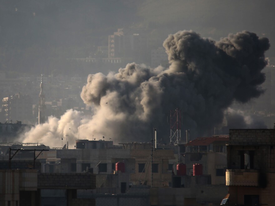 Smoke billows into the sky above eastern Ghouta after a wave of airstrikes Monday. Over the past month, the region of nearly 400,000 has seen its deadliest spasm of violence in years.