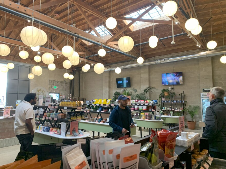 Rose Mary Jane customers walk through the various cannabis products available inside the dispensary.