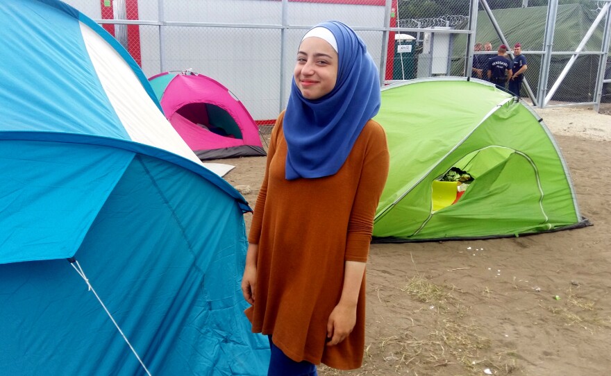 Judy al-Shtawi, 17, a Syrian refugee, waits outside a migrant detention facility in southern Hungary, near the Serbian border. She was approached by an Austrian man, offering her and her siblings a free ride to the Austrian border. Such offers are illegal — considered as smuggling — and they declined.