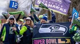 Seattle Seahawks fans holding Super Bowl signs