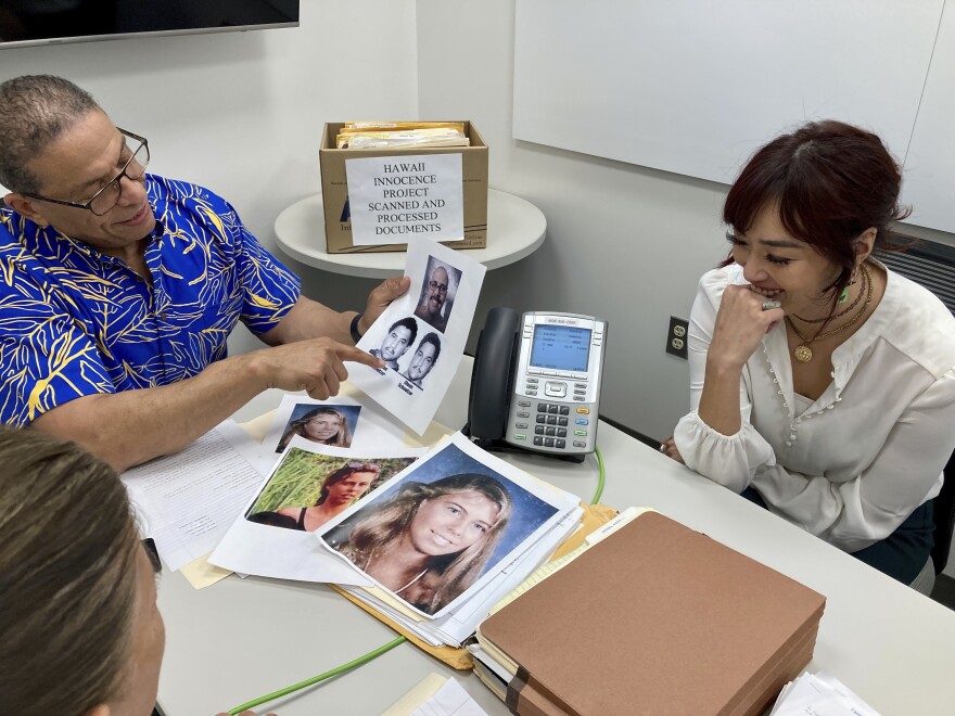 Hawaii Innocence Project co-director Kenneth Lawson, left, and law student Skye Jansen go over files and photos related to the 1991 murder of Dana Ireland in Honolulu on Tuesday, Jan. 17, 2023. A petition filed Monday, Jan. 23 outlining new evidence in one of Hawaii's biggest criminal cases asks a judge to release Albert “Ian” Schweitzer, a Native Hawaiian man who has spent more than 20 years in prison for the sexual assault, kidnapping and murder of Ireland, a white woman, on the Big Island.