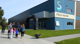 People walk into the Soldotna Field House during a grand opening ceremony on Saturday, Aug. 16, 2025 in Soldotna, Alaska.