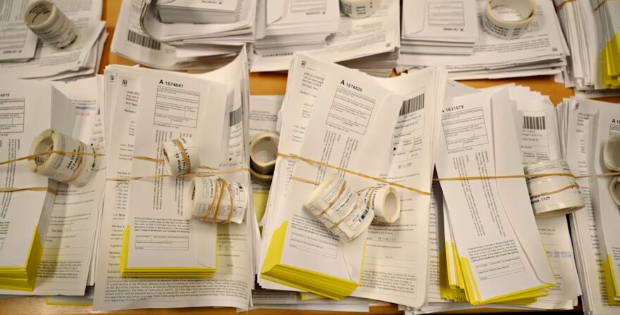 Absentee ballot packets include an inner envelope, outer mailing envelope, a mailing label and barcode. The barcode on the inner envelope acts as a form of voter identification.