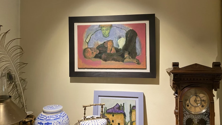 “Consolation: A Study," a painting by Andy Newman, the husband of "Wicked" author Gregory Maguire, hangs in their home.