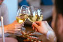 Friends clinking with glasses of wine