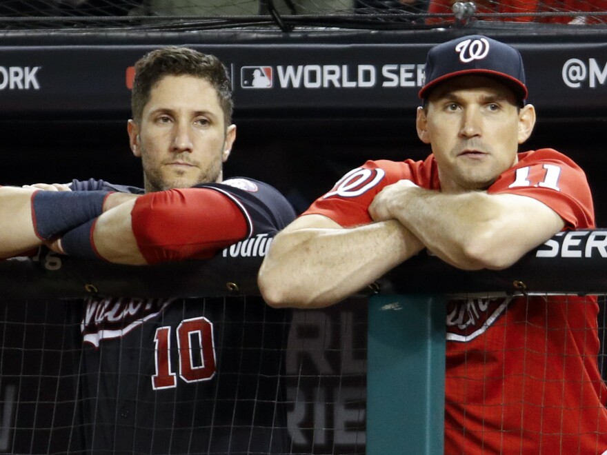 Washington Nationals catcher Yan Gomes, left, and first baseman Ryan Zimmerman watch during the ninth inning of Game 5 of the World Series.