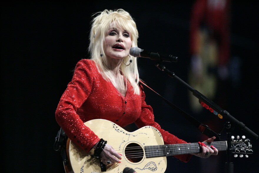 FILE - Dolly Parton performs at a United Way of America convention in Detroit, Friday, May 15, 2009.