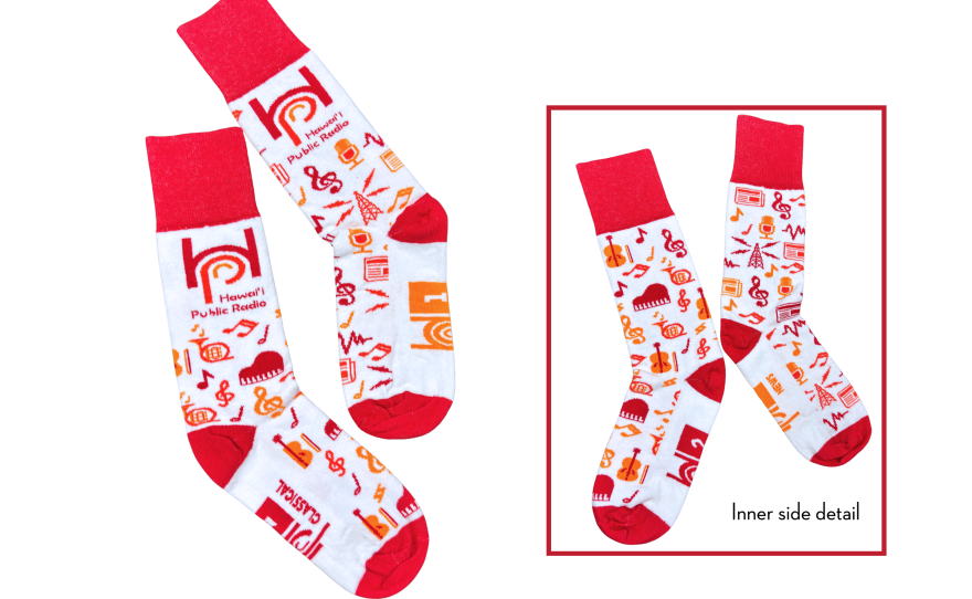A pair of cotton blend, crew-length socks that celebrates both HPR-1 and HPR-2 with red, orange and yellow radio and music-themed designs on a white backing