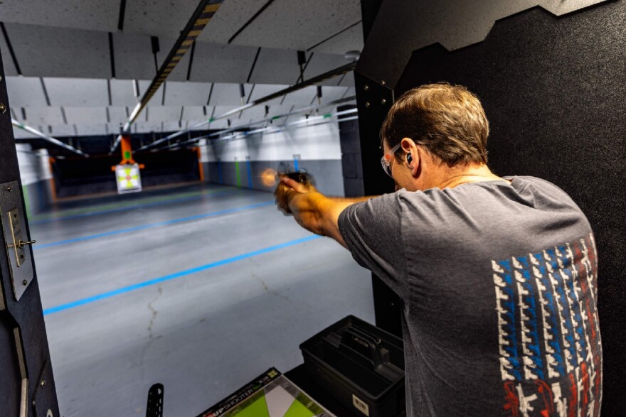 Toby Leary shoots a tactical pistol during a demonstration at the Cape Gun Works firing range of guns no longer allowed to be sold under the state's new gun control law.