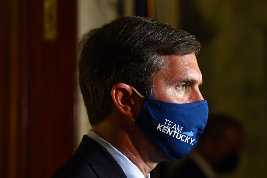 Kentucky Governor Andy Beshear speaks to reporters following the signing of bills related to the American Rescue Plan Act at the Kentucky State Capitol in Frankfort, Ky., Wednesday, April 7, 2021. 