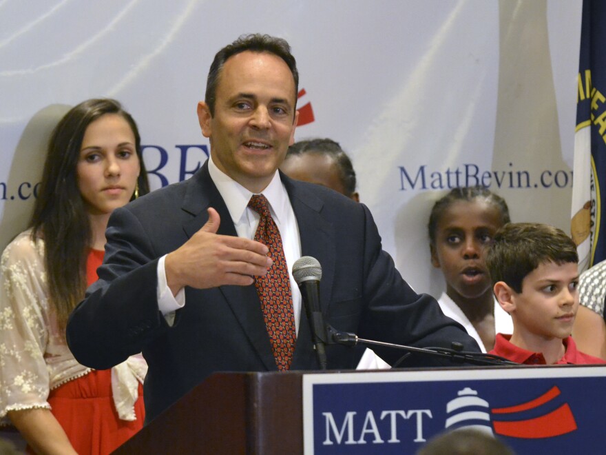 Kentucky Republican gubernatorial candidate Matt Bevin addresses supporters in Louisville, Ky., Tuesday. He leads the GOP primary by 83 votes.