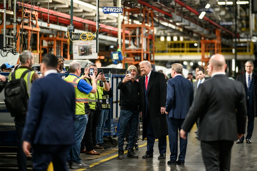 President Donald Trump talks with workers at Ford's F-150 factory in Dearborn.