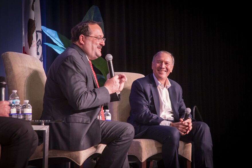 Former Secretary of State Mike Pompeo (right) speaks with Iowa Republican Party of Iowa chairman Jeff Kaufmann at a state party fundraiser at the Rhythm City Casino in Davenport, Iowa on March 11, 2022.