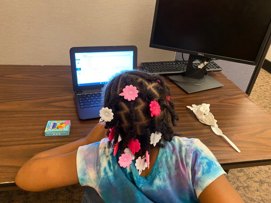 A student does lessons remotely from the Steve Smith Family Foundation virtual learning center.