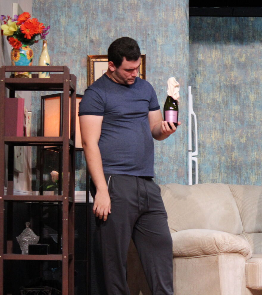 Alex Gonzalez in the role of Adam eyes a Molotov cocktail his sister has stored in his refrigerator.