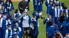 The Hartford Public High School class of 2021 jumped and cheered as they streamed out of Dunkin' Donuts Park, diplomas in hand.