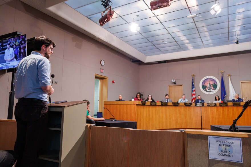 Democratic nominee for U.S. House William Lawrence speaks against Flock Safety cameras at a Lansing City Council meeting on Aug. 24, 2026.