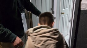 Opening the door to their new home.