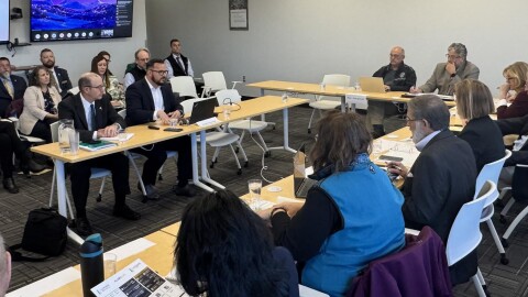 Glenfarne Communications Director Tim Fitzpatrick (table, left) and Glenfarne Alaska LNG President Adam Prestidge address state lawmakers at the inagural meeting of the Alaska Gasline Cacucus on Tuesday, Oct. 7, 2025 in Anchorage, Alaska.