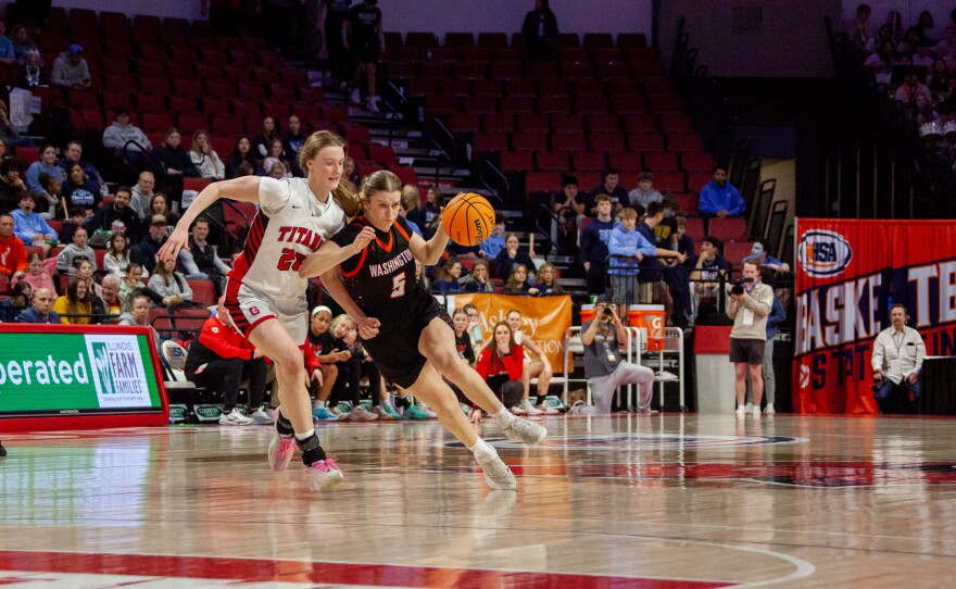 Girls high school basketball players inside an arena