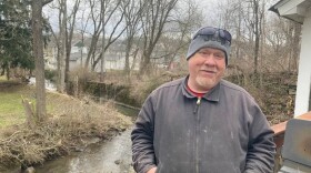 Danny Bostwick’s house in East Palestine, Ohio is only yards away from Sulfur Run. He worries that chemicals in the stream bed will soak into the soil. (Courtesy of Julie Grant / The Allegheny Front)