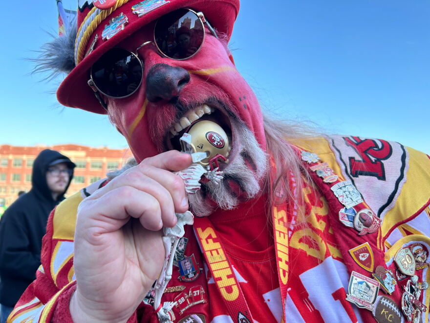 Lynn Schmidt is known as "Weird Wolf," and has the tattered jerseys of AFC West opponents under his outfit's right sleeve.