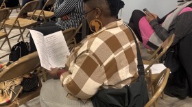 Ebony Nicole Smith peruses the three-page application for the New York State